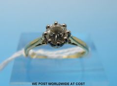 An 18ct gold ring set with a round brilliant cut diamond measuring approximately 0.