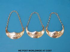 A set of three Peter and Ann Bateman Georgian hallmarked silver crescent-shaped bottle labels,
