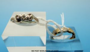 Two 9ct gold rings one set with three diamonds and the other set with diamonds in heart shapes