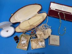 A large collection of costume jewellery to include beads, brooches, necklaces,