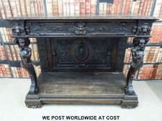 A 19thC carved oak sidetable or buffet,
