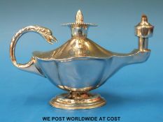 A hallmarked silver table lighter formed as a Roman oil lamp with removable fire wand to centre,