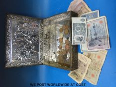 A collection of coins and early 20thC German notes etc in Dutch vintage tin,