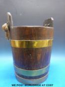 A Georgian coopered peat bucket with rope handle