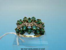 A 9ct gold ring set with emeralds and diamonds (size O)