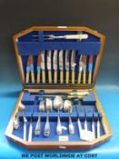 An oak cased silver plated canteen of cutlery, marked E.