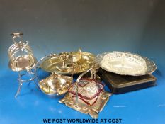 A quantity of silver plated items to include an Asprey toast warmer/ rack, cased set of open salts,