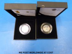 A cased Royal Mint World Wildlife Fund 50 pence silver proof no 0378 and a 2010 Girl Guiding