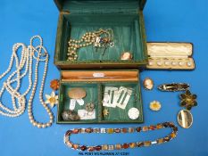 A white metal and agate brooch, an agate egg pendant, mother of pearl brooches and buckles,