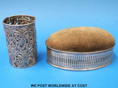 An oval hallmarked silver-mounted sewing box with pin cushion lid (length 13cm) together with a