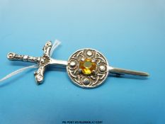 A Scottish brooch in the form of a sword set with a citrine