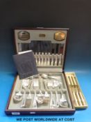 A cased Viners canteen of cutlery together with a set of knives