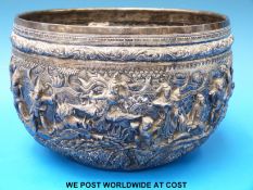 A Burmese silver bowl with figures and court scenes in high relief.