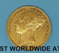 An 1864 young head gold full sovereign,shield back,