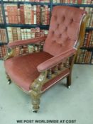 A 19thC mahogany upholstered armchair with bobbin turned supports under arms