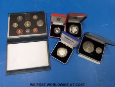 Four cased silver coins comprising a millennium £5, £1 piedfort,