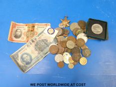 A small collection of coins together with an Atlantic star medal,