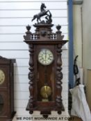 A Vienna style wall clock with horse to pediment