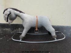 A Merrythought rocking donkey on a chrome base (100cm long)
