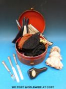 A small ceramic headed doll, height 14cm, together with a cased coral stick pin of a fly,