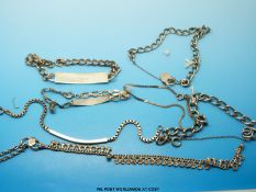 Five white metal bracelets,