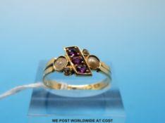 An 18ct gold ring set with three rubies,