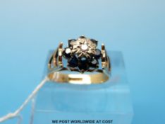 A 9ct gold diamond and sapphire ring (size J)