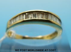 An 18ct gold ring set with baguette cut diamonds (size N)