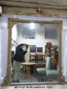 A large 19th century gilt framed ornate over-mantel mirror (135 x 114cm)