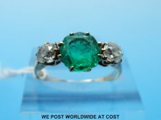 An 18ct gold ring set with an old cut emerald of approximately 1.
