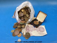 A collection of coins both UK and World, some tokens, modern crowns, some redeemable coins,