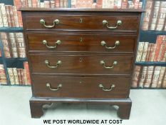 A George III mahogany graduated straight front chest of four drawers with original brass handles