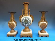 A hardstone and cloisonné gilt mounted clock and garniture