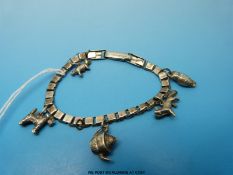 A silver charm bracelet with five charms