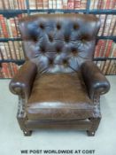 A John Lewis brown leather armchair