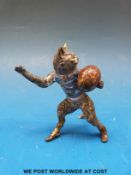An Austrian cold painted figure of a cat with a rugby ball (height 6cm)