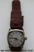 A c1920's gentleman's 'transitionary' style wristwatch with white enamelled dial, secondary seconds,
