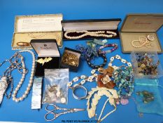 A collection of costume jewellery to include shell necklaces, bracelets, brooches, pearl necklace,