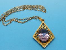 A 9ct gold pendant set with an amethyst on a 9ct gold chain