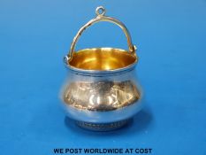A Russian silver tea strainer with gilt wash interior and swing handle marked 84 with a kokoshik