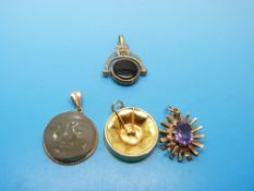 Three yellow metal pendants, all marked 9ct gold, one in the shape of a drum,