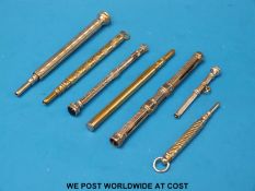 Seven various propelling pencils to include amethyst topped examples