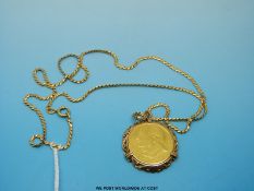 A 22ct gold Churchill coin / medallion in a 9ct gold mount on an 18ct gold chain (22.