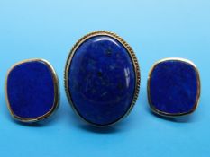 A 9ct gold ring set with lapis lazuli and a similar pair of 9ct gold earrings