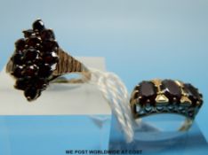 Two 9ct gold rings each set with garnets