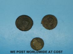 Three bronze Roman coins,