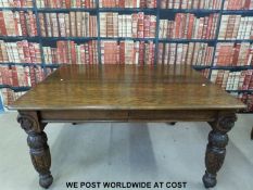 An oak dining or kitchen table with carved legs (H73, W140,