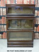 A Globe Wernicke two section oak bookcase having drawer below with further section above (H140, W87,