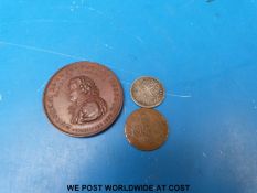 A silver Charing Cross six penny token,
