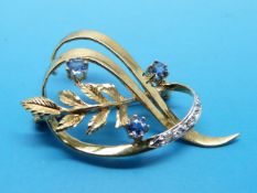 A 9ct gold brooch set with diamonds and tanzanite